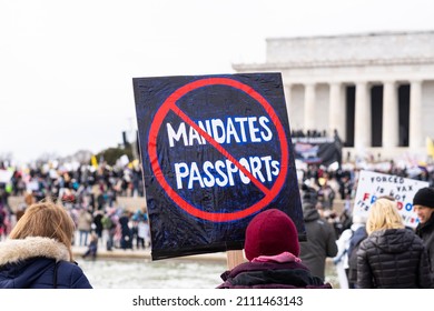 Washington, DC- January 23rd, 2022: A Person Holding Up A Sign Showing Opposition To Covid Vaccine Mandates And Covid Vaccine Passports At The Defeat The Mandates Rally.