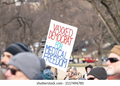 Washington, DC- January 23rd, 2022: A Democrat Holding Up A Sign Showing Opposition To Covid Vaccine Mandates And Covid Vaccine Passports At The Defeat The Mandates Rally.