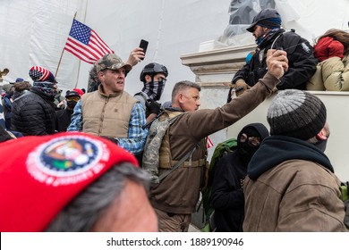 Washington, DC - January 6, 2021: Pro-Trump Protesters Uses Papper Spray Against Police During Capitol Building Riot.