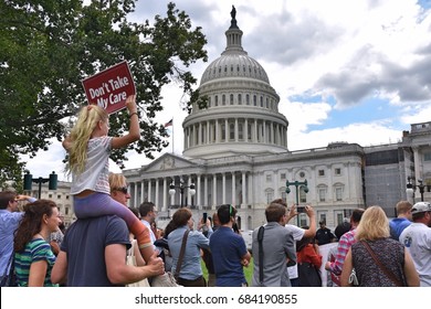 WASHINGTON, DC -- JULY 25 2017: Crowds Gather For A Rally At The Steps Of The US Capitol After The Senate Vote On The Motion-to-proceed For The Trumpcare Bill.