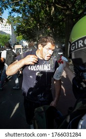 WASHINGTON, DC - JUNE 27, 2020: Demonstrator Suffering From Tear Gas Outside The White House