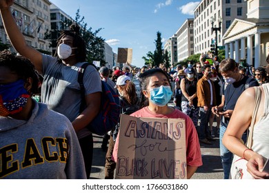 WASHINGTON, DC - JUNE 27, 2020: Demonstrators Protest Peacefully Outside The White House