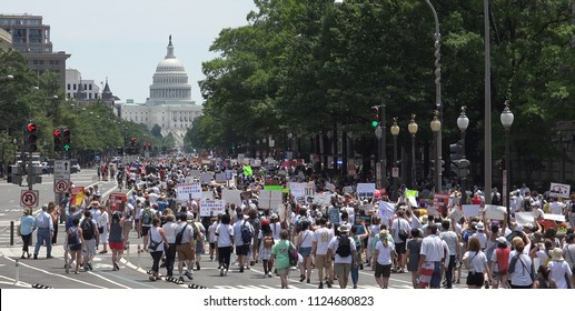 WASHINGTON, DC - JUNE 30, 2018: Protesting Trump's Immigration Policy & Family Detention And Separation, Thousands March From Rally Near White House To The Justice Department. Families Belong Together