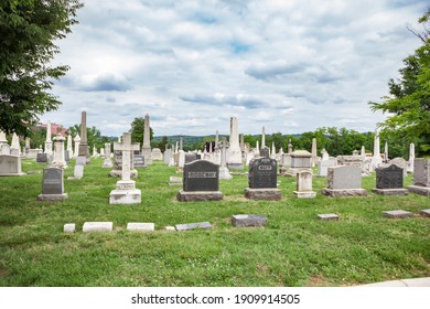 Washington, DC - June 7, 2015: Graves along the foot path at the historic Congressional Cemetery, one of the first burial grounds in Washington, DC