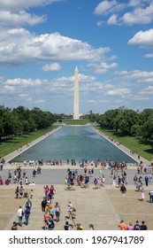 Washington D.C. - June 8, 2016: People gathered on the National Mall, on a beautiful summer day.