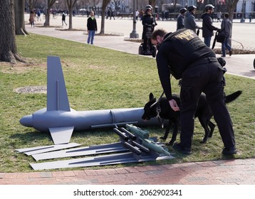 Washington, DC – M
March 10, 2018:  A Secret Service Officer Using A A Bomb Sniffing Dog Investigates A Drone Prop To Be Used By Protesters At The White House.