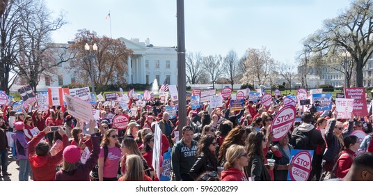 WASHINGTON, DC - MAR. 8 2017: Demonstrators at the White house, part of A Day Without a Woman during International Women's Day.  Rally to protest the "global gag rule," which Pres.Trump reinstated.  