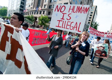 WASHINGTON, DC - MAY 1: Immigrants and their supporters march to the White House on International Workers' Day, to call for legal reforms and an end to workplace raids May 1, 2009 in Washington, DC.