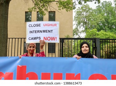 WASHINGTON, DC - MAY 4, 2019: Protestors outside of Chinese Embassy hold up signs regarding Uighur internment camps