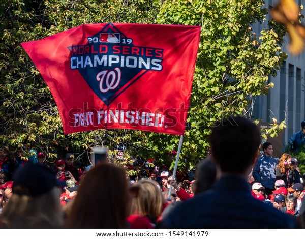 Washington\
DC - November 01 2019:  Flag Waving During Washington Nationals\
World Series Parade in Downtown Washington\
DC