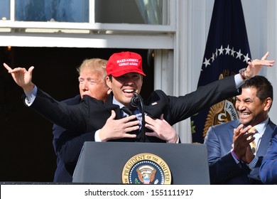 WASHINGTON, DC - NOVEMBER 04, 2019: Make America Hug Again! President Donald Trump Hugs Kurt Suzuki On The White House Balcony At Ceremony For The Washington Nationals World Series Win.