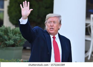 WASHINGTON, DC - NOVEMBER 26, 2019: President Donald Trump Waves To The Crowd Assembled At The Annual Thanksgiving Turkey Pardon Ceremony.