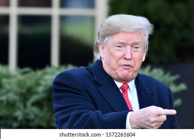 WASHINGTON, DC - NOVEMBER 26, 2019: President Donald Trump Points To His Left As He Addresses The Crowd Assembled At The Annual Thanksgiving Turkey Pardon Ceremony.