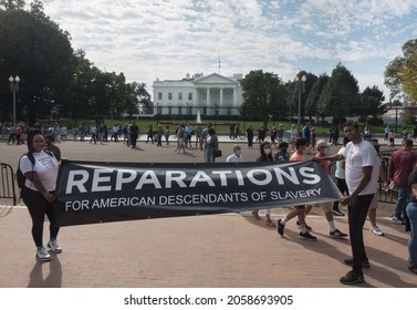 
WASHINGTON, DC - OCT. 16, 2021: White House In Bg, Activists Rally To Demand Pres. Biden Sign An Executive Order To Study Reparations, And Establish A Commission For Descendants Of American Slavery.