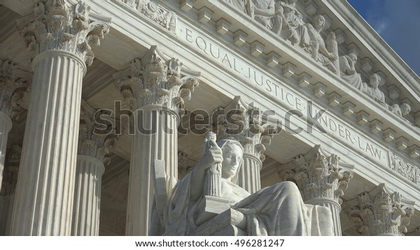 WASHINGTON, DC - OCT 3, 2016:   Equal\
Justice Under Law engraving above entrance to US Supreme Court\
Building.  Supreme Court faces the US Capitol\
Building.