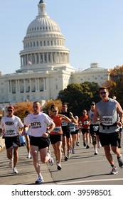 WASHINGTON, DC - OCTOBER 25: Runners compete in the Marine Corps Marathon on October 25, 2009 in Washington, D.C.