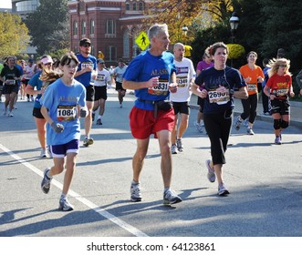 WASHINGTON, D.C. - OCTOBER 31: young and old- numerous participants of Marine Corps Marathon near the Smithsonian Castle October 31, 2010 in Washington, D.C.
