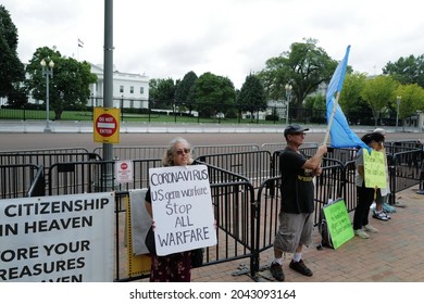 Washington, DC – September 17, 2021: A Protester At The White House Holds A Sign Encouraging Peace And Questioning The Origins Of COVID And Condemning Germ Warfare.