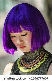 WASHINGTON, DC - UNITED STATES, APRIL 11, 2015: Japanese Woman In A Purple Wig