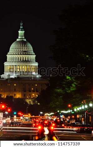 Washington DC, United States Capitol building at night with car lights trails