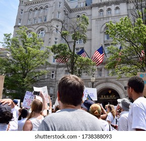 Washington D.C. / United States - June 30, 2018: Families Belong Together March. Protestors Pass In Front Of Trump International Hotel.