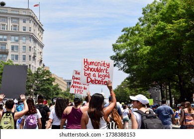 Washington D.C. / United States - June 30, 2018: Families Belong Together March. Protestors Hold Signs About Immigration And Humanity.