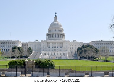 Washington DC, United States landmark. National Capitol building and insurrection barriers in the foreground.