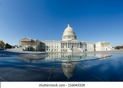 Washington DC, US Capitol Building and mirror reflection over glass dome East facade