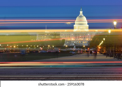 Washington DC - US Capitol Building with car lights trails foreground at night
