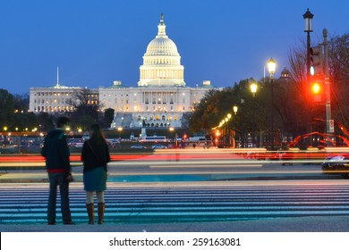 Washington DC - US Capitol Building With Car Lights Trails Foreground At Night
