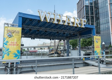 Washington, DC US - June 16 2022: Wharf Outdoor Free Weekday Concert Series, Small Covered Stage On Waterfront Presented By Sponsor Pacifico Beer In 2022