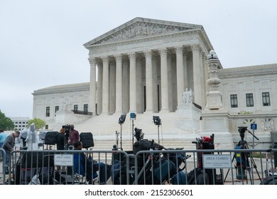 Washington, DC US - May 3, 2022: The Supreme Court with metal barricades and a media area nest to where protestors are gathering one day after the leaked draft opinion Roe V Wade confirmed authentic