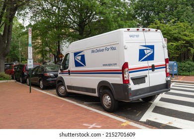 Washington, DC US - May 3, 2022: United States Postal Service Vehicle Illegally Parked With Its Back End Partially Blocking A Pedestrian Crosswalk While The Carrier Is Completing Their Route On Foot