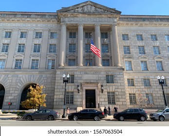 Washington, DC / US - November 06, 2019: Federal Workers Take A Smoking And Vaping Break Outside The Department Of Commerce Building On 15th Street