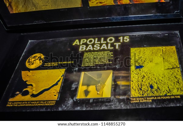 Washington DC, USA; 05 24 2014: A\
sample of a Basalt rock from the surface of the Moon by the Apollo\
15 mission exhibited at the Smithsonian Air and Space\
Museum.