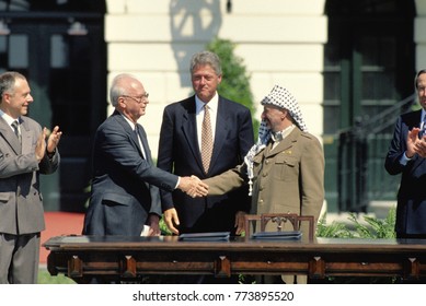 Washington, DC. USA, 13th September, 1993.
 Prime Minister Yitzhak Rabin Of Israel And Palestine Liberation Organization Chairman, Yasser Arafat, Shake Hands  After Signing The Peace Accords