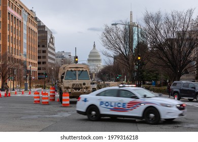 Washington, DC, USA - 16 January, 2021: Military Vehicles Blocking Streets Around The US Capitol Building Ahead Of The Inauguration Of Joe Biden As The 46th US President, Police Car Passing By