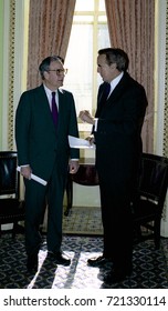 Washington DC. USA, 27th October, 1990
Senators George Mitchell And Robert Dole Look Over The Budget Bill Before Sending To The Full Senate For Approval. 
