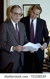 Washington DC. USA, 27th October, 1990
Senators George Mitchell And Robert Dole Look Over The Budget Bill Before Sending To The Full Senate For Approval. 
