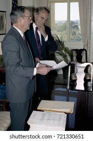 Washington DC. USA, 27th October, 1990
Senators George Mitchell And Robert Dole Look Over The Budget Bill Before Sending To The Full Senate For Approval. 
