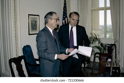 Washington DC. USA, 27th October, 1990
Senators George Mitchell And Robert Dole Look Over The Budget Bill Before Sending To The Full Senate For Approval. 
