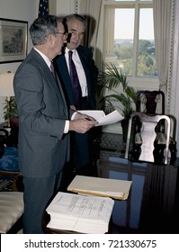 Washington DC. USA, 27th October, 1990
Senators George Mitchell And Robert Dole Look Over The Budget Bill Before Sending To The Full Senate For Approval. 
