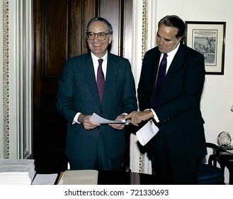 Washington DC. USA, 27th October, 1990
Senators George Mitchell And Robert Dole Look Over The Budget Bill Before Sending To The Full Senate For Approval. 
