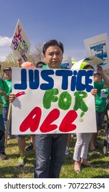 WASHINGTON, DC, USA - APRIL 10, 2013: Immigration Reform Rally At U.S. Capitol. Justice For All Sign.