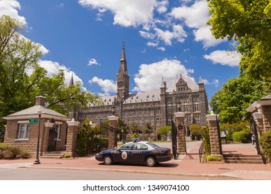 WASHINGTON, DC, USA - APRIL 28, 2010: Public Safety Campus Police Car At Entrance To Georgetown University. Healy Hall At Rear.