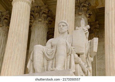 Washington, DC, USA - April 3, 2022: The Entrance To The Historic U.S. Supreme Court Building On Capitol Hill Is Flanked By Two Iconic Marble Figures Created By Renown Sculptor James Earl Fraser.