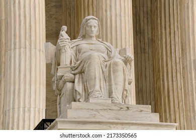 Washington, DC, USA - April 3, 2022: The Entrance To The Historic U.S. Supreme Court Building On Capitol Hill Is Flanked By Two Iconic Marble Figures Created By Renown Sculptor James Earl Fraser.