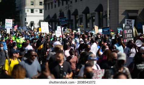 Washington, D.C. | U.S.A. - Aug 28, 2021: March On For Voting Rights (People Marching In The Street Against Voter Suppression)