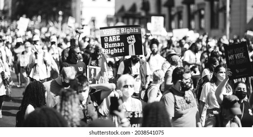 Washington, D.C. | U.S.A. - Aug 28, 2021: March On For Voting Rights (People Marching In The Street Against Voter Suppression)