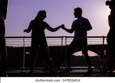 Washington, D.C. / USA - August 12, 2019: Latin Dancers Gather Outside Along The Georgetown Waterfront And Practice Their Bachata, Salsa, Zouk And Kizomba Dancing In A Public Park With A Speaker.